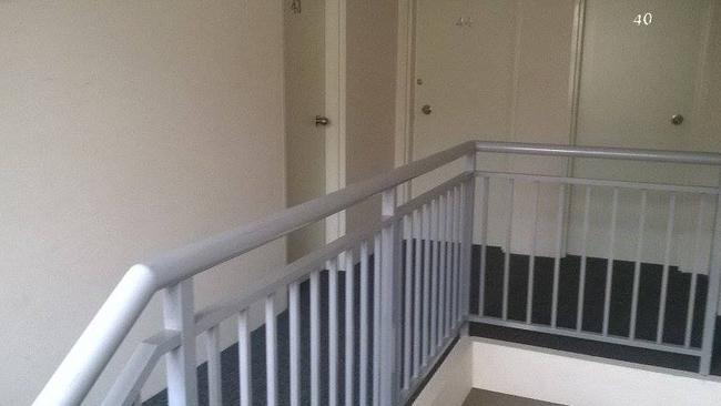 Neighbours described how the woman in a black hijab set Monis’s first wife on fire and then fled down the staircase (above). Picture: JT.