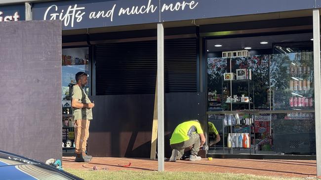 Repairs being carried out at Helensvale's Top Dog Tobacconist after it was ramraided in late June. Picture: Charlton Hart