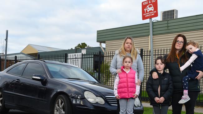 Parents including Keren Barak and Elizabeth Michelini, pictured with their children, say they have been unfairly fined. Picture: Josie Hayden