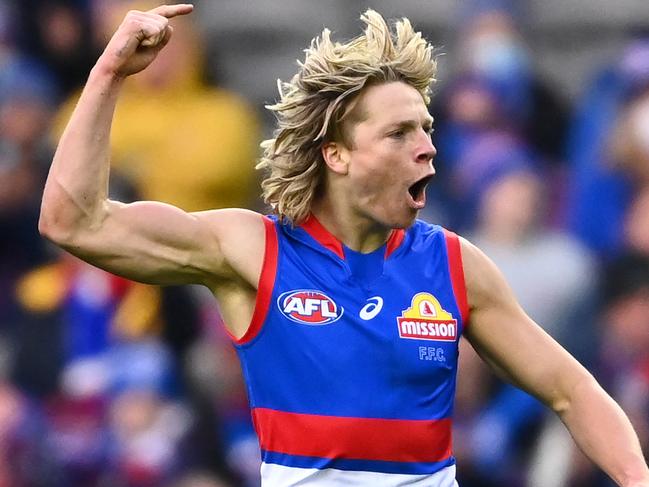 MELBOURNE, AUSTRALIA - JULY 04: Cody Weightman of the Bulldogs celebrates kicking a goal during the round 16 AFL match between Western Bulldogs and North Melbourne Kangaroos at Marvel Stadium on July 04, 2021 in Melbourne, Australia. (Photo by Quinn Rooney/Getty Images)