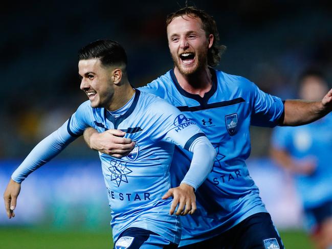 Marco Tilio of Sydney celebrates scoring a goal with team mate Rhyan Grant of Sydney during the Round 20 A-League match between the Central Coast Mariners and the Sydney FC at Central Coast Stadium in Gosford, Sunday, February 23, 2019. (AAP Image/Brendon Thorne) NO ARCHIVING, EDITORIAL USE ONLY