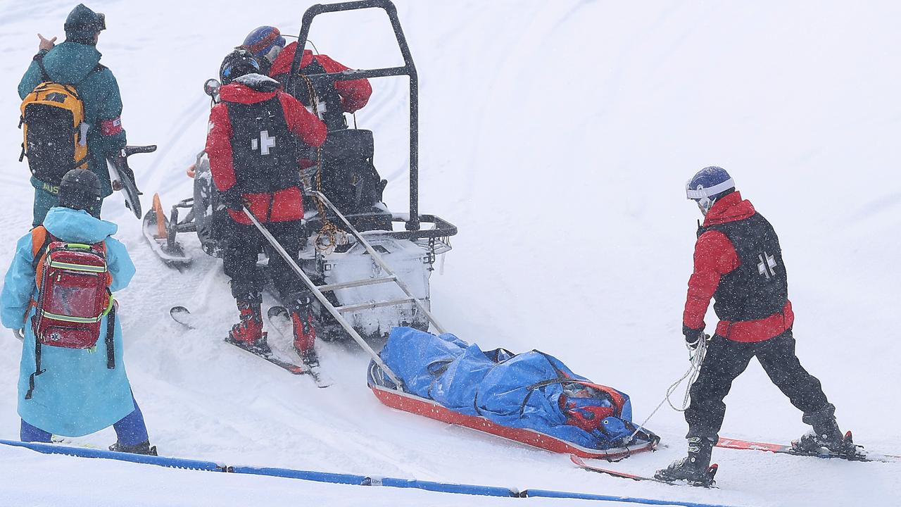 Belle Brockhoff is stretched off the mountain after crashing during the snowboard mixed team cross quarterfinals. Picture: Cameron Spencer/Getty Images