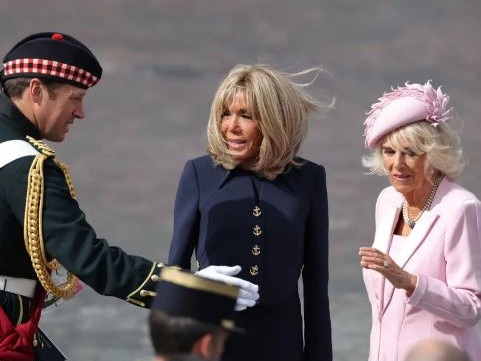 Major Johnny Thompson with Brigitte Macron and Queen Camilla. Picture: Getty Images