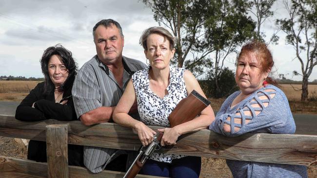 Angle Vale Residents Tracey and Bill Gilkes (from left), Shirley Bell and Deb Jackson in front of the proposed super school site at Angle Vale. Picture: Russell Millard/AAP