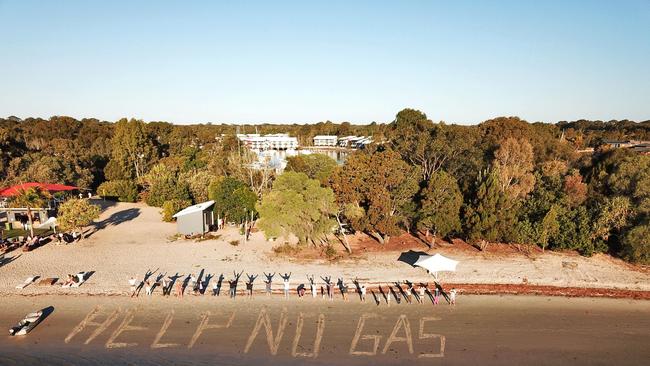 South Stradbroke Island residents gathered at the beach to send an urgent message to Queensland Attorney-General Shannon Fentiman. Picture: supplied