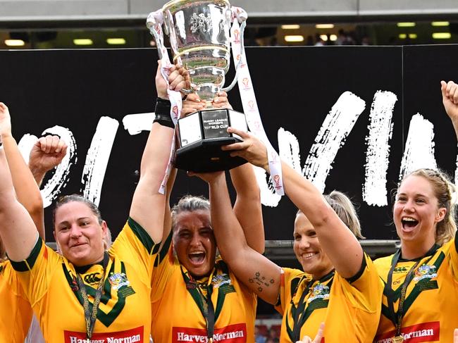 Australia celebrates winning the Women's Rugby League World Cup Final between the Australian Jillaroos and the New Zealand Ferns played at Suncorp Stadium in Brisbane, Saturday, December 2, 2017. (AAP Image/Darren England) NO ARCHIVING, EDITORIAL USE ONLY