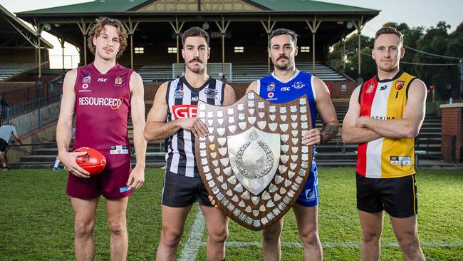 2021 Adelaide Footy League division one captains before last season’s finals series. Goodwood Saints, represented by Lou Whitelock (right) are the favourites this year. Picture: Mark Brake