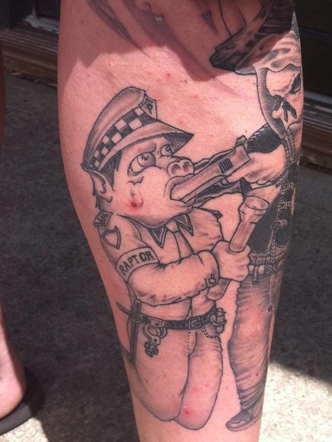 Raptor’s work has drawn fire from criminals. This tattoo was inked on the leg of a senior Rebels bikie gang member. He’s since removed it.