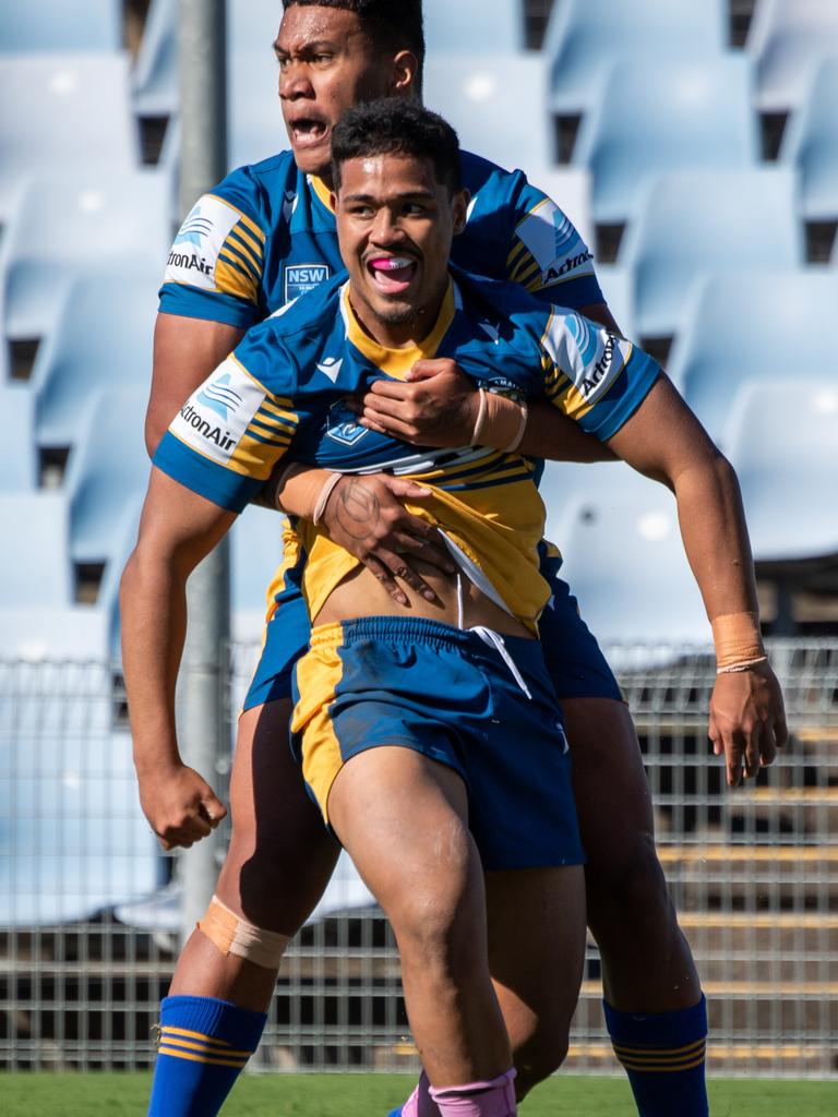 Jubilant Parramatta players celebrate a try. Picture: Monique Harmer