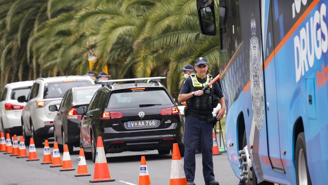 Victoria Police pull over drivers at a roadside drug and alcohol testing site in Southbank. Picture: Ian Currie