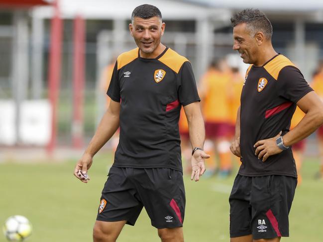 John Aloisi (left) and Ross Aloisi discuss tactics during their Brisbane Roar coaching stint. Picture: AAP Image/Glenn Hunt