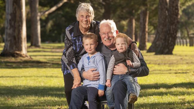 Jim Clancy, 71, with wife Lyn and grandchildren Lachie, 4, and Angus, 2, he has had 3 recent knee surgeries with out of pockets close to $1000. Picture: Rob Leeson.