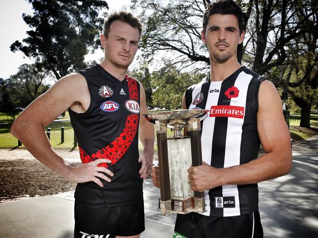 Collingwood skipper Scott Pendlebury and essendon skipper Brendon Goddard with the Anzac Day trophy. Picture: Michael Klein