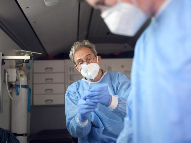 Doctors prepare syringes with the COVID vaccine. Picture: AFP