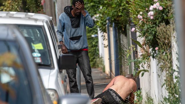 A concerned man watches on as John begins to overdose. Picture: Jason Edwards