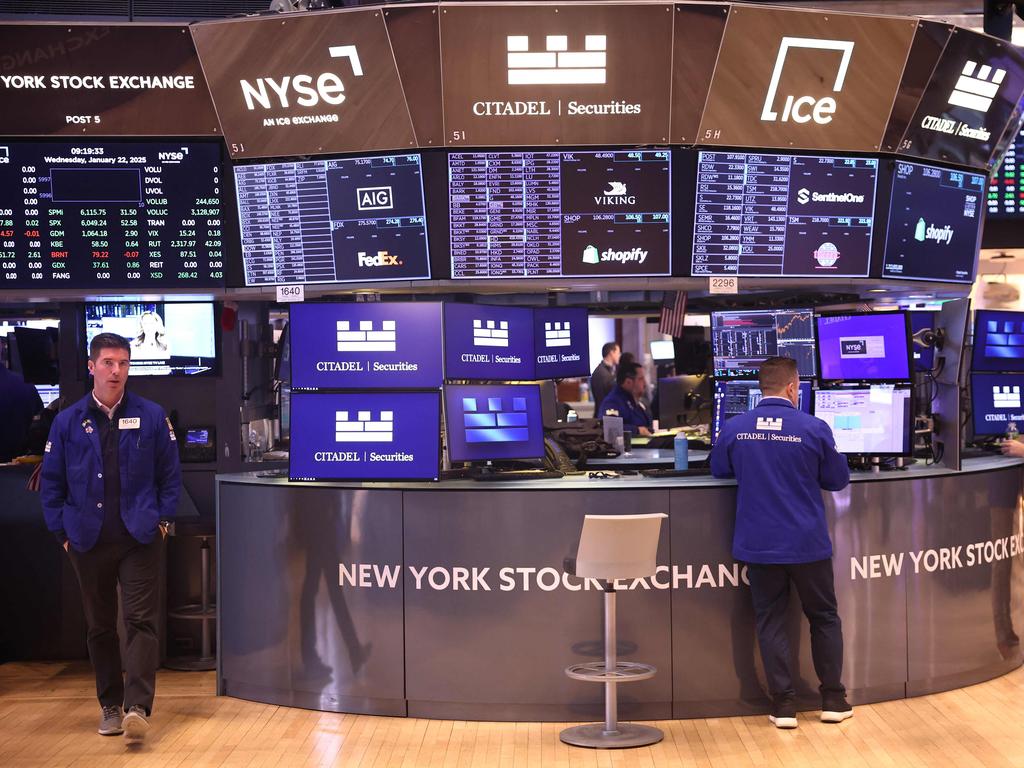 NEW YORK, NEW YORK - JANUARY 22: Traders work on the floor of the New York Stock Exchange during morning trading on January 22, 2025 in New York City. Stocks continued an upward swing opening up high a day after the Dow Jones closed up 500 points and the S&P 500 approaching an all-time high. The rise comes after OpenAI CEO Sam Altman, SoftBank CEO Masayoshi Son and Oracle Chairman Larry Ellison made an announcement alongside President Donald Trump that they will create a new company, called Stargate, to grow artificial intelligence infrastructure in the U.S.   Michael M. Santiago/Getty Images/AFP (Photo by Michael M. Santiago / GETTY IMAGES NORTH AMERICA / Getty Images via AFP)