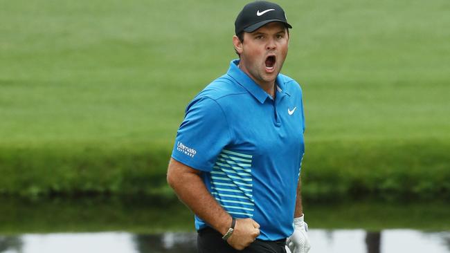 Patrick Reed celebrates his eagle on the 15th.