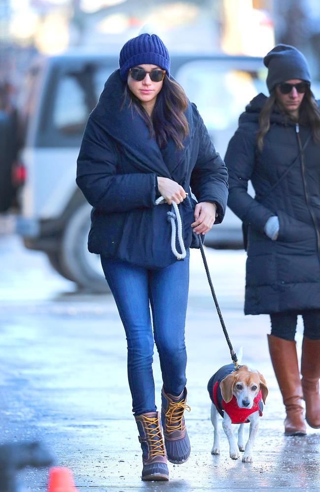 Meghan Markle with her dog Bogart, who she gave away when she moved from Toronto. Picture: Splash News