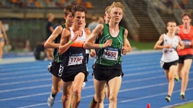 Ipswich athlete Jude Thomas leads the way with club mate Alex Davies in third during the Queensland under-18 3000m championships at QSAC.