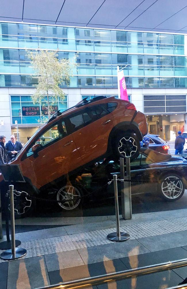 The two cars from inside the building … yikes. Picture: Strolling_Bone via Reddit