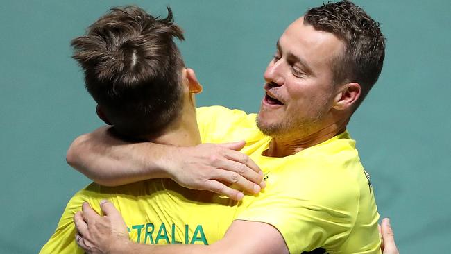 Hewitt hugs Alex de Minaur after a Davis Cup match. Picture: Alex Pantling/Getty