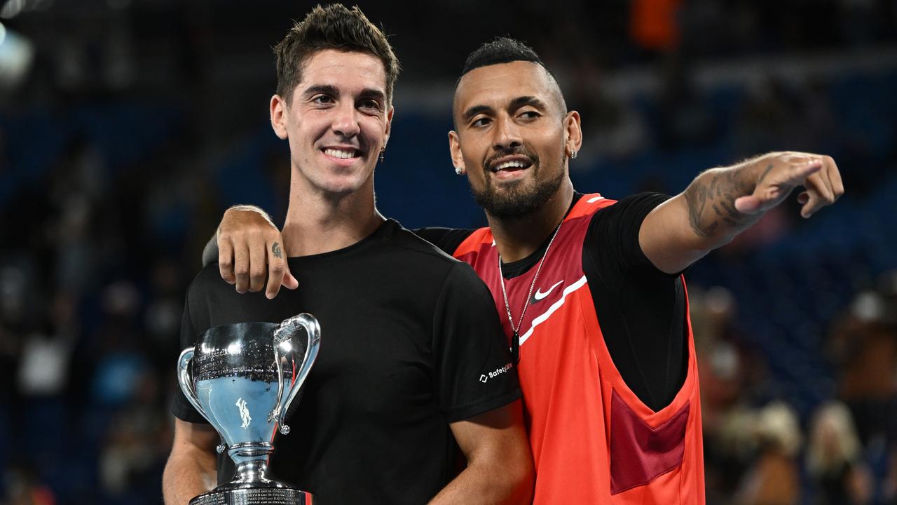 Thanasi Kokkinakis and Nick Kyrgios celebrate their title. Photo by Quinn Rooney/Getty Images.