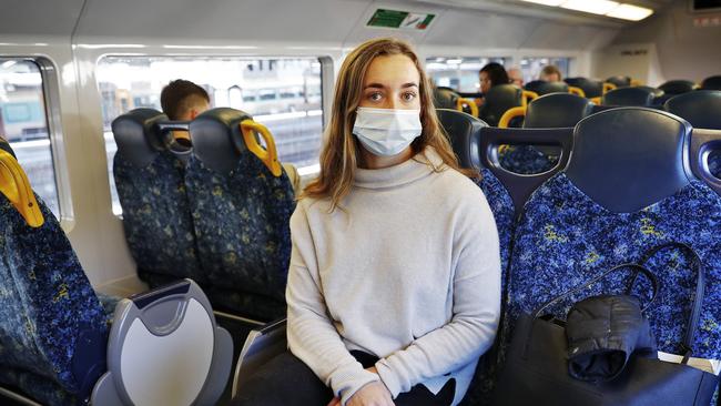 Lily Leighton from Port Macquarie pictured wearing a face mask whilst on a train at Central Station in Sydney after the recent outbreak of COVID-19. Picture: Sam Ruttyn