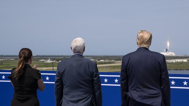 President Donald Trump, right, Vice President Mike Pence, and Karen Pence view the SpaceX flight to the International Space Station, at Kennedy Space Center.