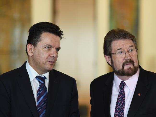 Senator Nick Xenophon and Senator Derryn Hinch helped the Government pass the election-triggering union bill last week. Picture: AAP Image/Lukas Coch