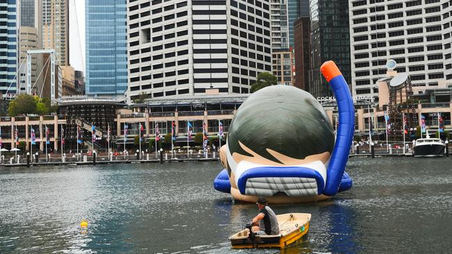 A giant snorkeller in Sydney’s Cockle Bay is intended to inspire Sydneysiders to head to tropical north Queensland. Picture: John Grainger