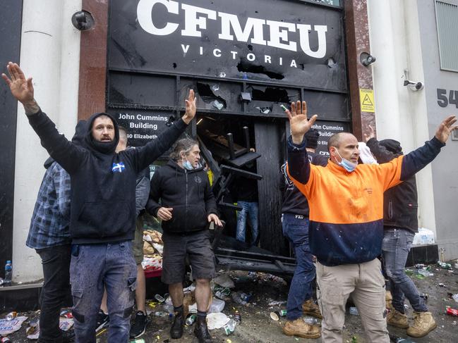 Union members try to stop construction workers from attacking the CFMEU headquarters. Picture: David Geraghty