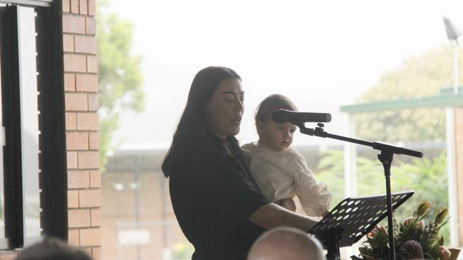 MY CAMERON: Tara holds daughter Lennie as she speaks from the heart to more than 500 people about her love for Cameron Rodney Hyde, who passed away from cancer. Photo: Alison Paterson