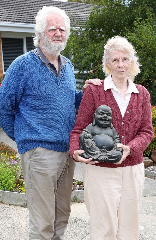 Bruce and Dresley Robins pictured with a similar but smaller buddha to the one stolen from their front yard.. Picture: Alan Barber