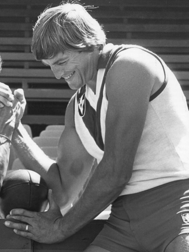 Round cuts an impressive figure during an arm wrestle in his heyday