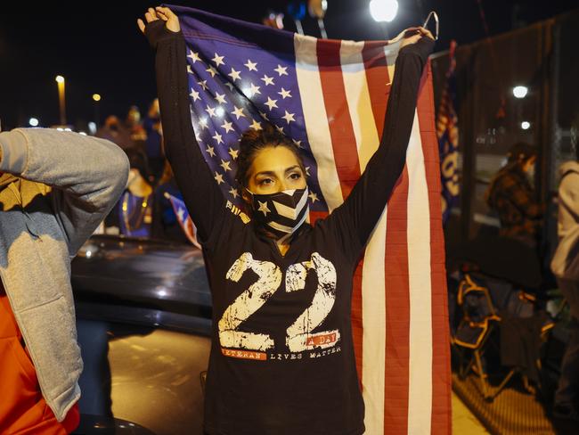 India Diaz dances while waiting for President elect, Joe Biden, to appear for his victory speech. Picture: Angus Mordant