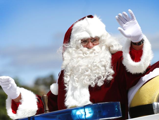 eastern shore christmas street parade with santa,, waiving to his fans from the old fire truck picture;KIM EISZELE