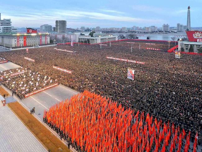 Thousands of North Koreans pictured in a huge show of support for Kim Jong-un who announced plans to test-fire a ballistic missile capable of reaching the US mainland. Picture: AFP