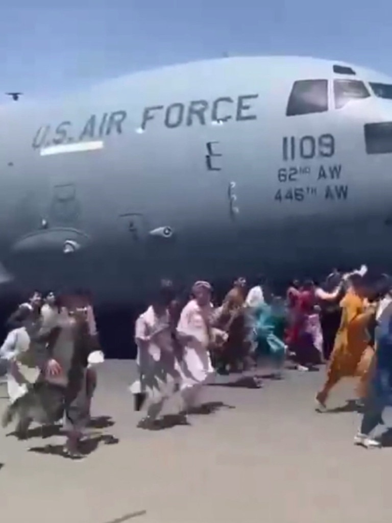 Afghans running alongside the C-17 plane as it was preparing to take off. Picture: Supplied