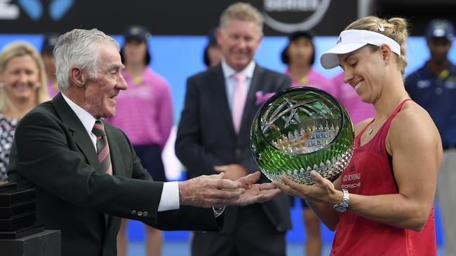 Ken Rosewall – who has been embroiled in the BBY collapse – presenting Angelique Kerber the winner's trophy at the Sydney International Tennis Tournament in 2018. Picture: Dan Himbrechts