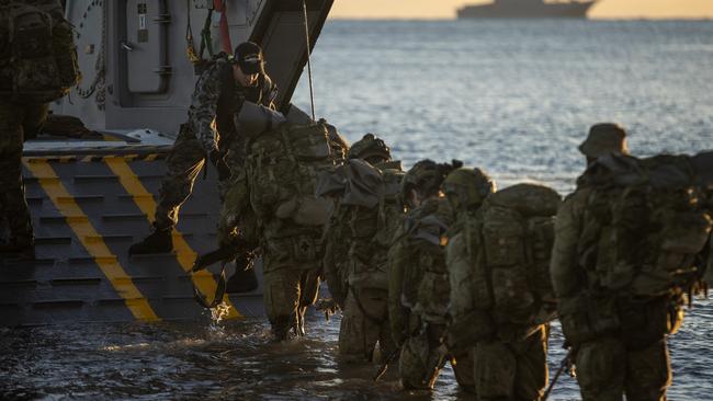 Australian Army soldiers board an Australian Amphibious Force landing craft during Exercise Sea Raider in 2023. Picture: Defence