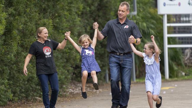 Jenni and Cameron Elliott with their daughters Kaitlyn, 6, and Libby, 9. Picture: AAP/Matthew Vasilescu