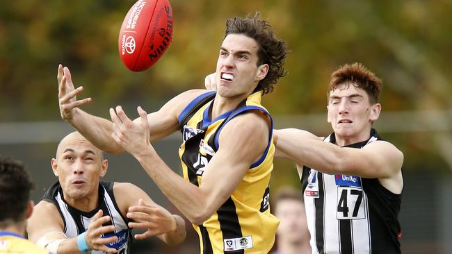 Max King of Sandringham attempts to mark the ball.