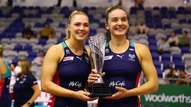 Melbourne Vixens co-captains Kate Moloney (left) and Liz Watson (right) with the Team Girls Cup trophy. Picture: Joanna Margiolis/AAP