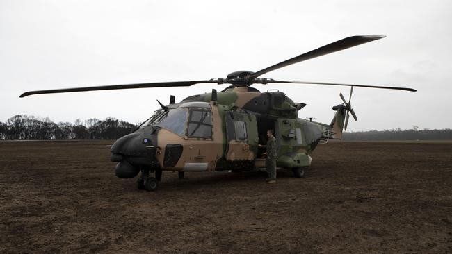 <i>HMAS Choules</i> MRH-90 Maritime Support Helicopter is seen on the Mallacoota airfield. Picture: AAP Image/Supplied by the Department of Defence.