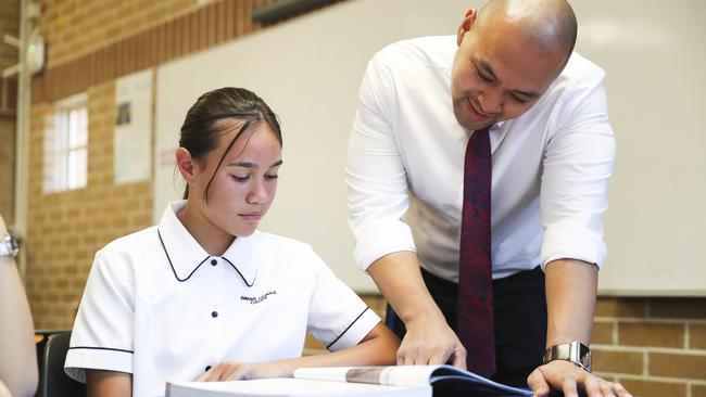 Talita with teacher Joneil Yuzon in mathematics class. Picture: Dylan Robinson