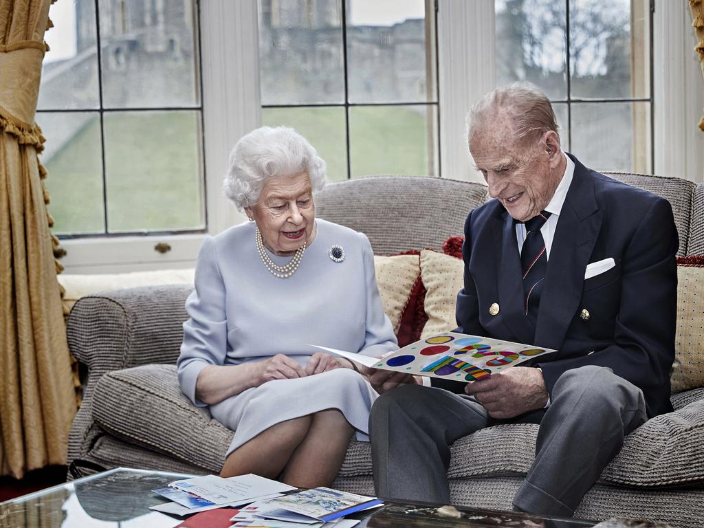 Queen Elizabeth II and Prince Philip, Duke of Edinburgh look at their homemade wedding anniversary card. Picture: Chris Jackson/Getty Images