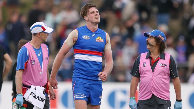 Jordan Roughead limps off the ground on Saturday. Picture: Wayne Ludbey