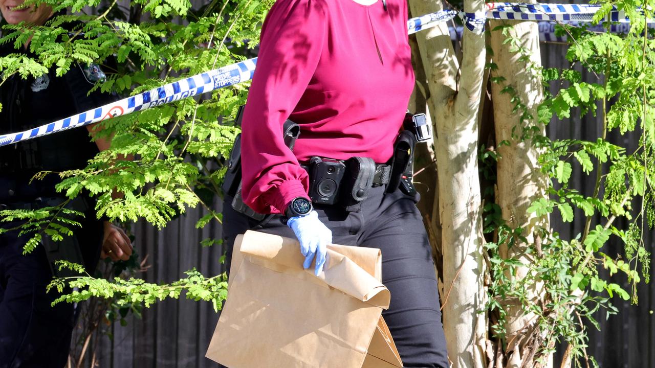 Police at the scene where a man has been taken into custody after a woman was left with serious burns after allegedly being set on fire. Photo: Steve Pohlner