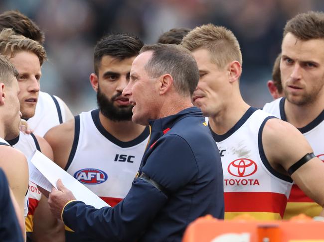 Adelaide coach Don Pyke talks with his players during the Round 19 match against Carlton at the MCG. Picture: AAP Image/David Crosling