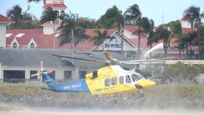 Emergency services at the scene of a helicopter crash between two Sea World Helicopters just outside the tourist park on a sandbank in the Southport Broadwater. Picture: Glenn Hampson.